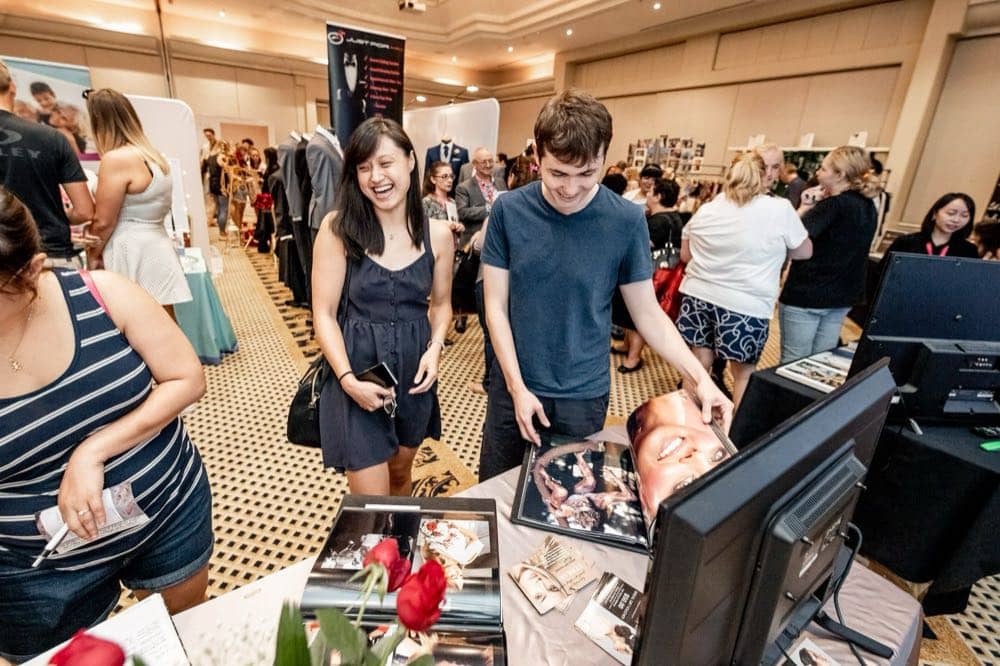 Couples meeting wedding suppliers on the floor of a Wedding Expos Australia expo
